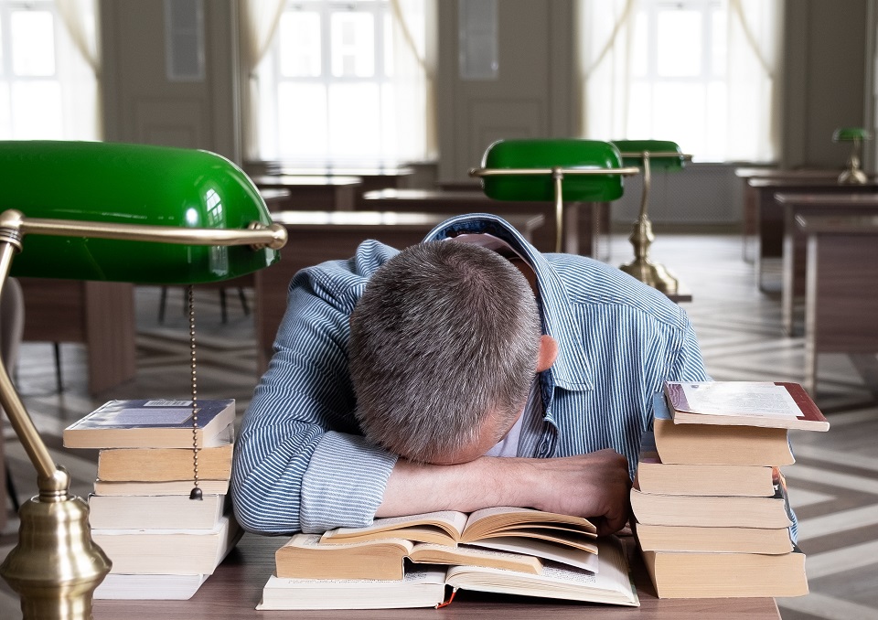 Man with head on his desk