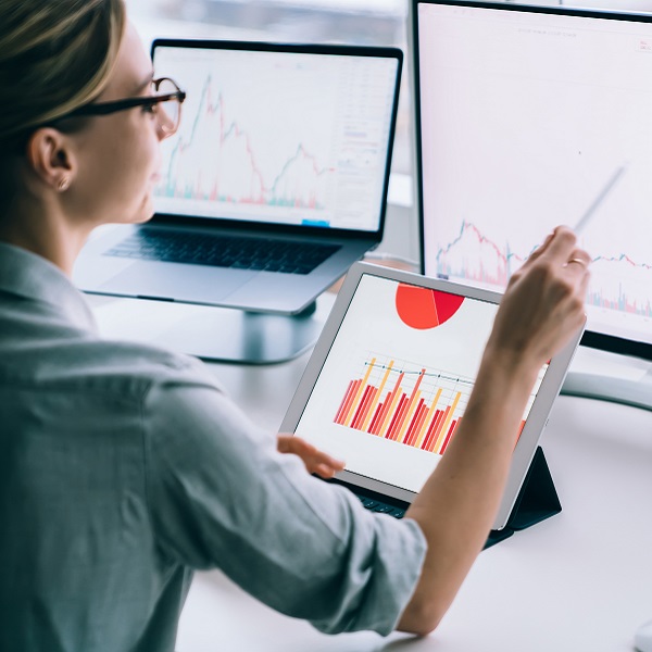 Woman looking at screen charts